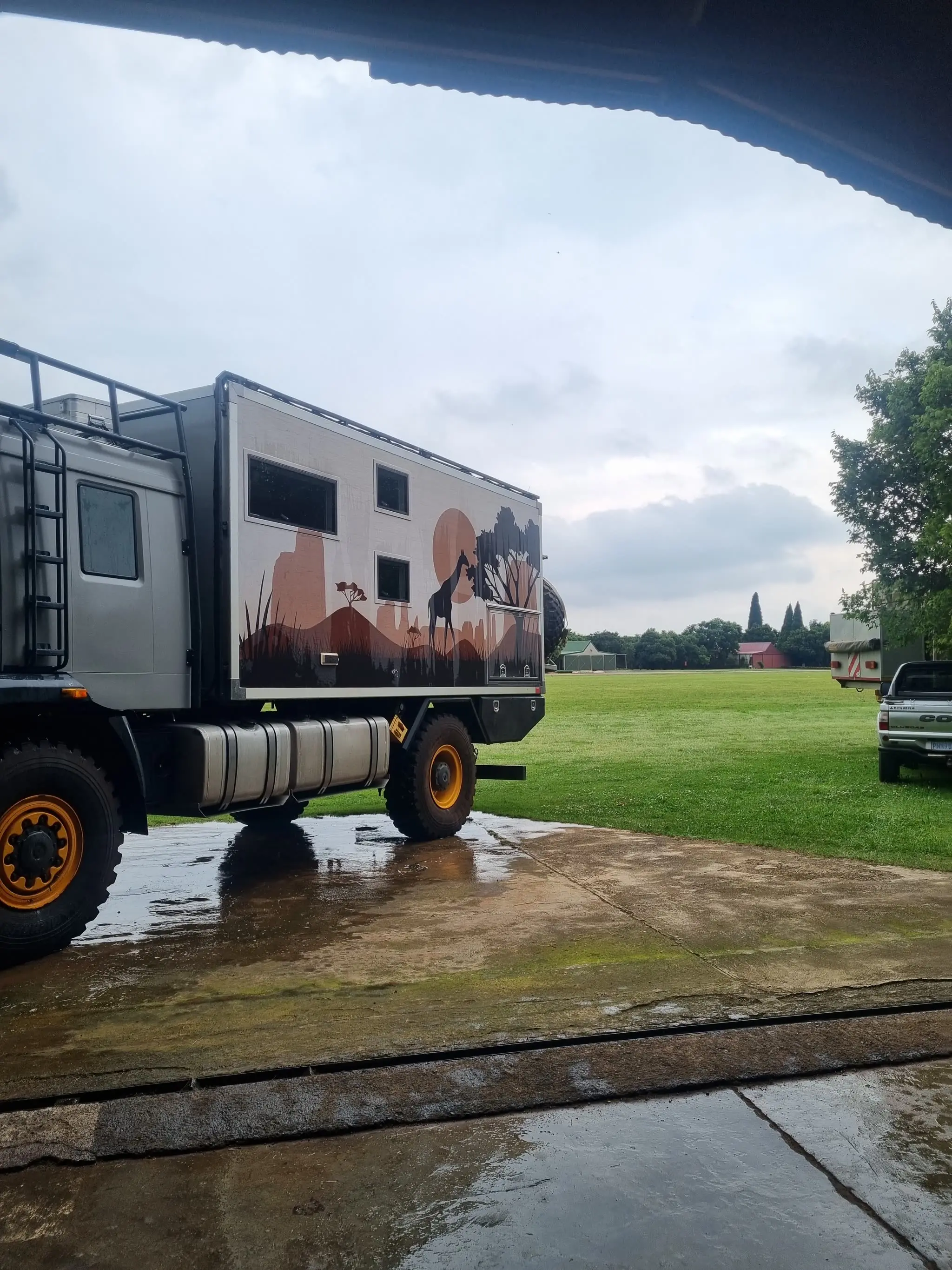The yard. 28 km from OR Tambo, off the main road, fenced and watched.